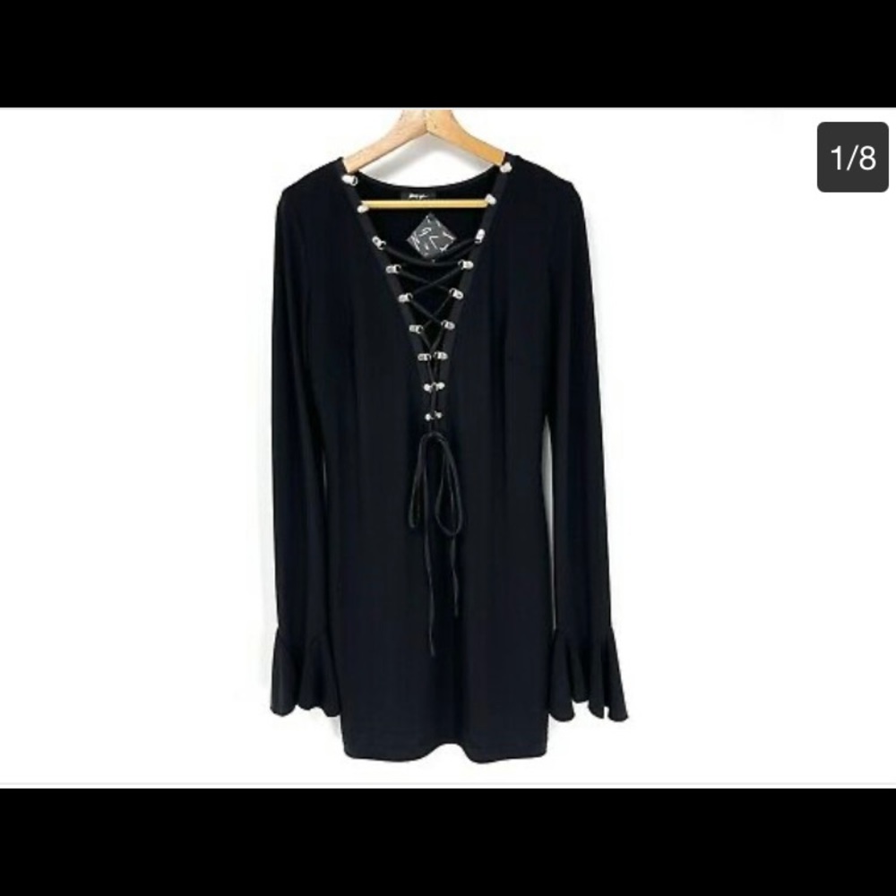 Long sleeve black mini dress with bell sleeves. Never been worn